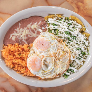 Chilaquiles with fried eggs, rice, and beans at El Paisano Des Moines