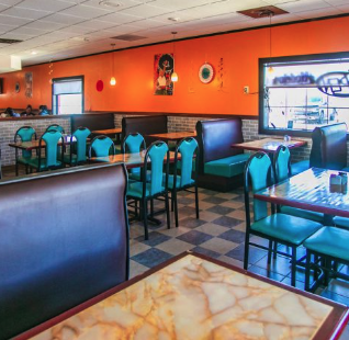 The colorful, welcoming dining room at El Paisano Mexican Food and Bakery in Des Moines